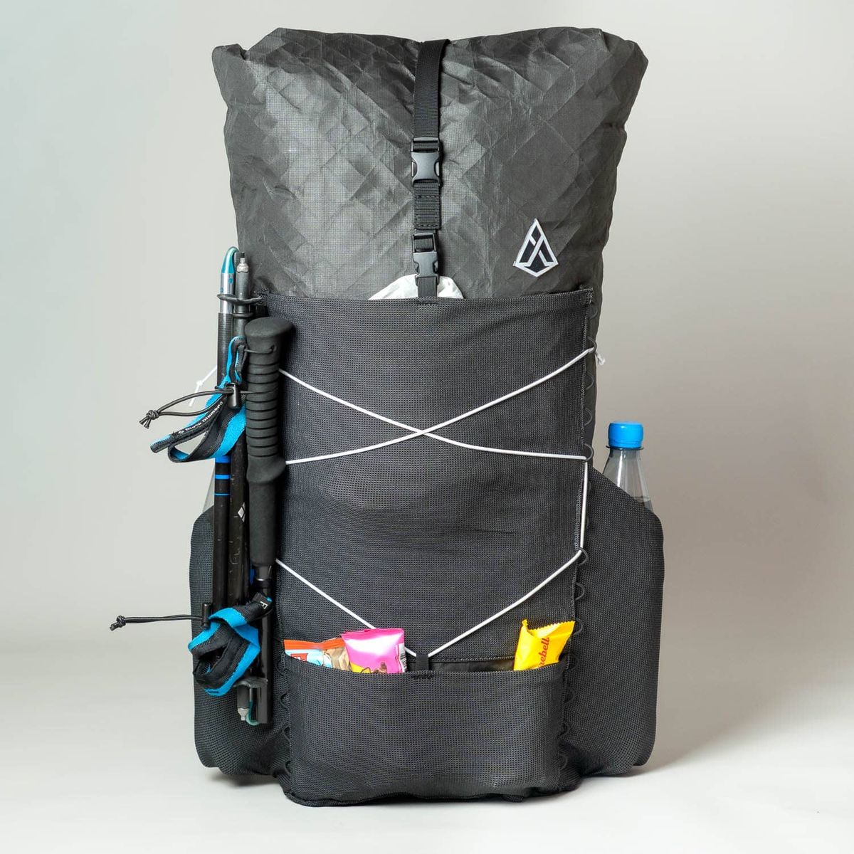 Agilist 2026 from the studio again, with hiking poles and a water bottle